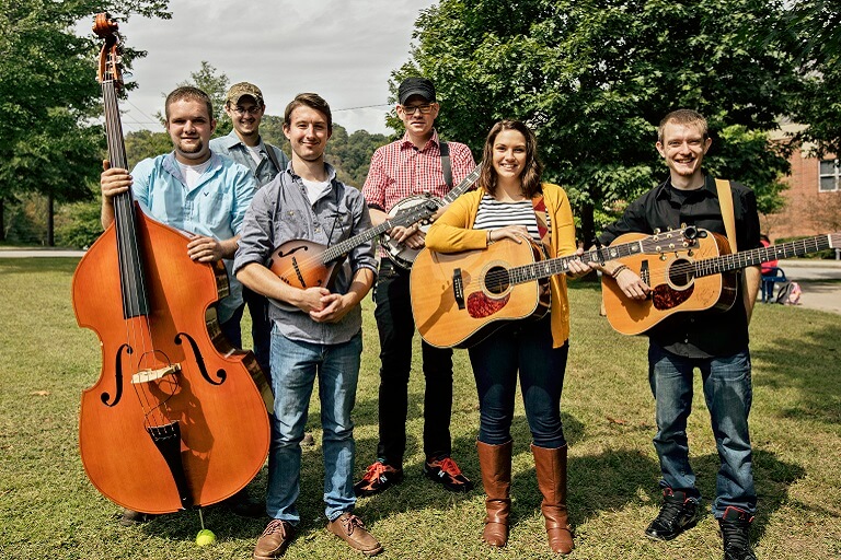 students holding instruments