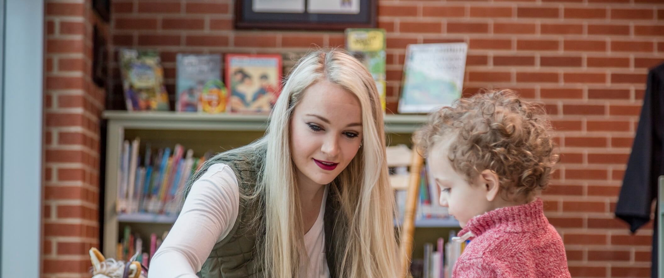mom and son in library