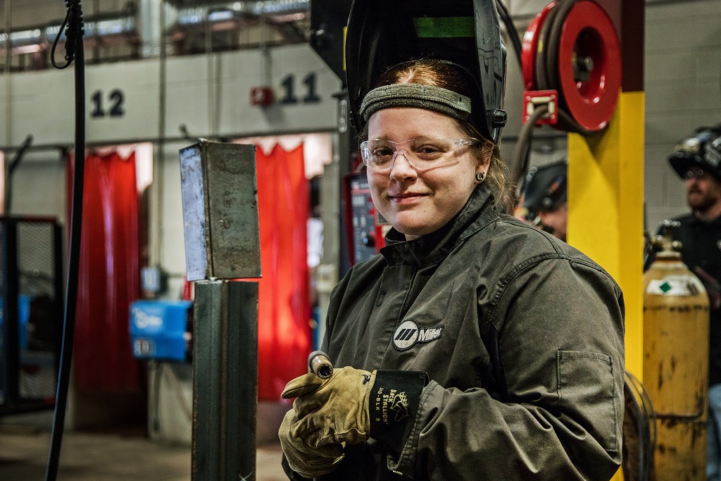 welding student being instructed in welding class